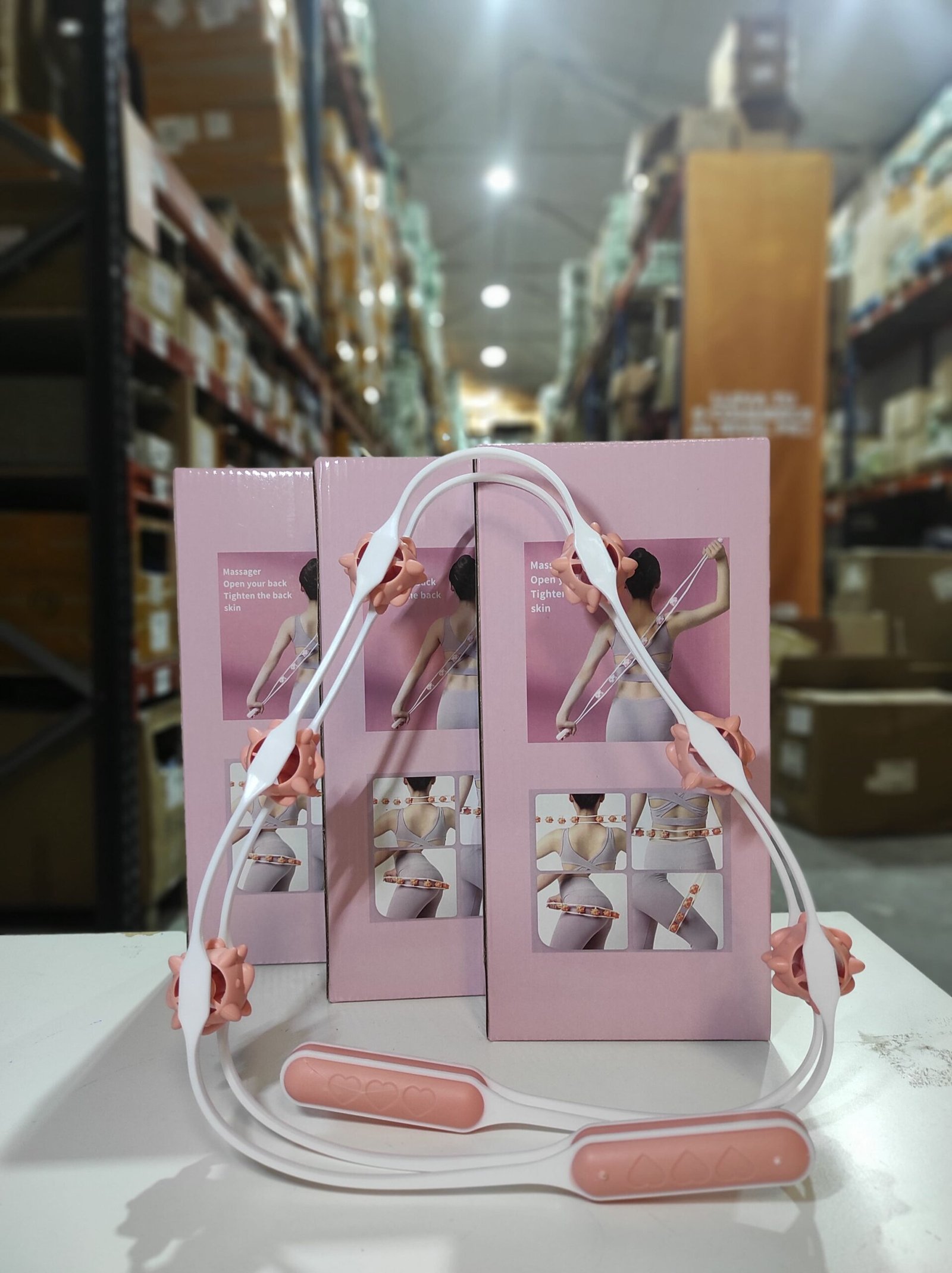 Rodillo manual de masaje corporal con 6 bolas giratorias – blanco y rosa - Imagen 8
