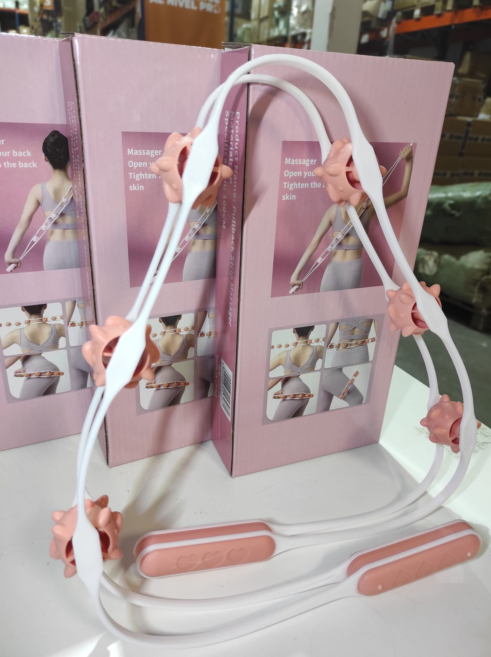 Rodillo manual de masaje corporal con 6 bolas giratorias – blanco y rosa - Imagen 2