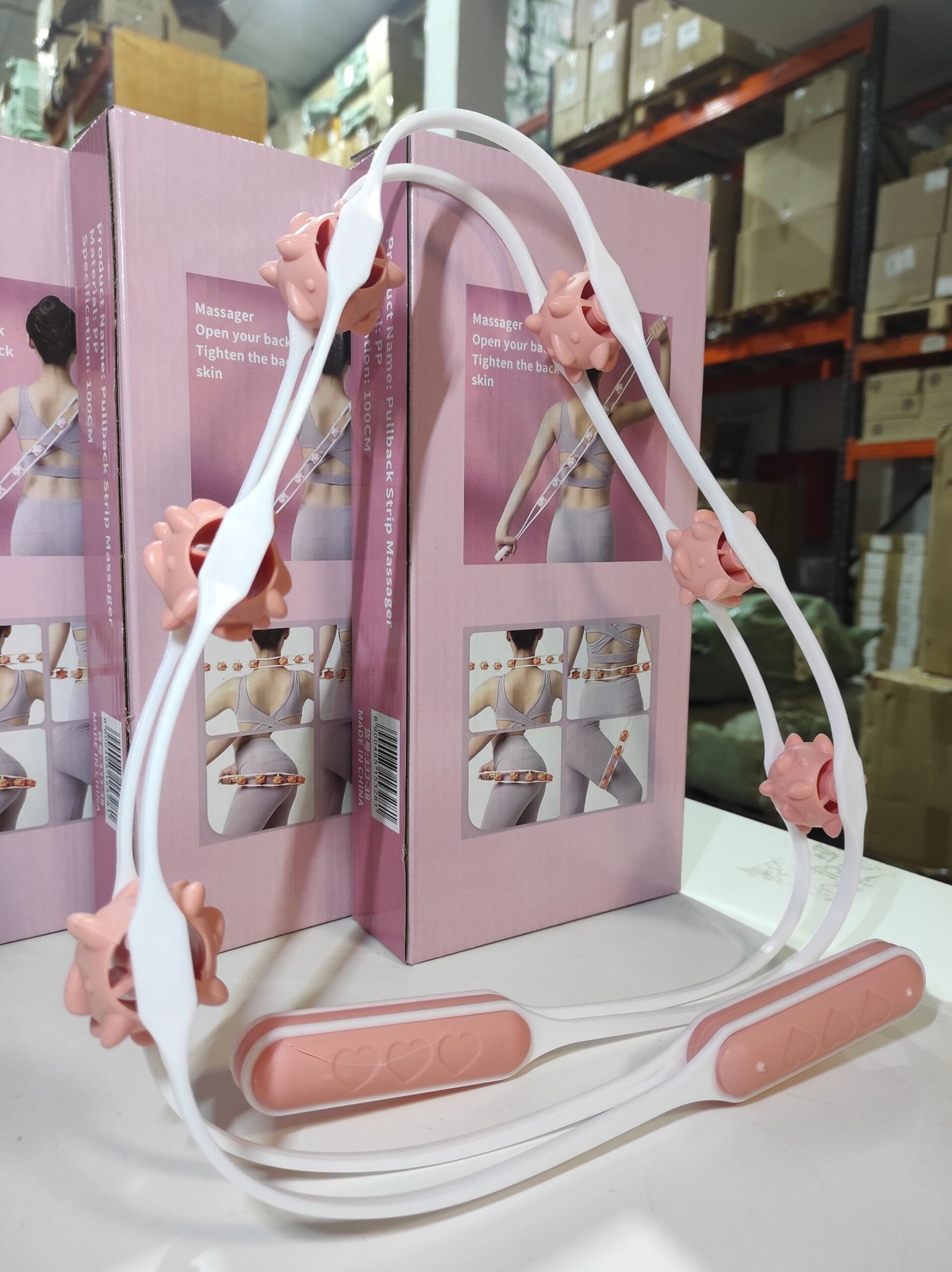 Rodillo manual de masaje corporal con 6 bolas giratorias – blanco y rosa - Imagen 3